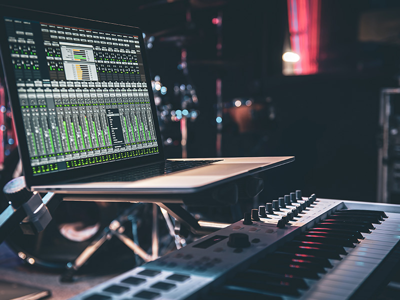 recording-studio-with-macbook-midi-keyboard-drums-protools